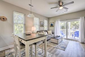 a living room with a table and a couch at Murrells Inlet Home Half-Mi to Marsh Walk! in Myrtle Beach