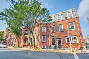 a large red brick building on a city street at Boston Apartment Walk to Beach and 2 Mi to Downtown in Boston