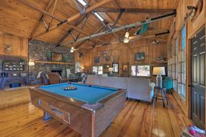 a barn with a pool table in a room at Waterfront Deck Home on Ouachita River! in Arkadelphia