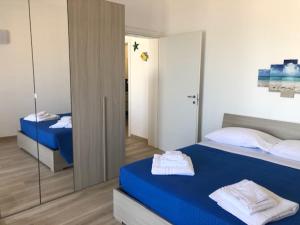 A bed or beds in a room at Viva Vista Mare Bilo Secondo Piano Vista
