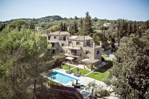 an aerial view of a house with a swimming pool at Filia Stone Villa in Gouvia