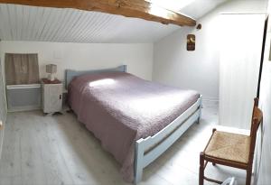 Postel nebo postele na pokoji v ubytování L'OASIS DES MARAIS La maison du Marais + 10 fotografií