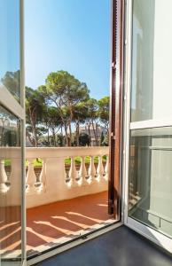 an open door to a balcony with vases at WE LOVE ROMA Guest House in Rome