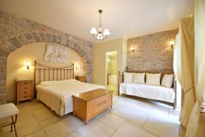 Posteľ alebo postele v izbe v ubytovaní Angelica Traditional Boutique Hotel