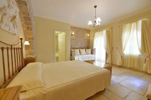Posteľ alebo postele v izbe v ubytovaní Angelica Traditional Boutique Hotel