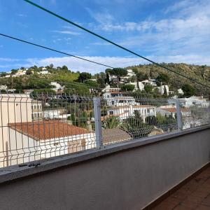 a balcony with a view of a city at Hilda's Room in Roses