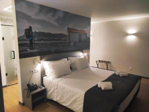 Cama ou camas em um quarto em Flag Design Hotel