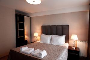 Säng eller sängar i ett rum på Hotel Winoterra