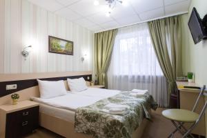 Llit o llits en una habitació de Hotel Voyage