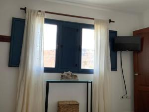 TV a/nebo společenská místnost v ubytování CALIMA Holiday House
