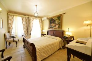 Posteľ alebo postele v izbe v ubytovaní Angelica Traditional Boutique Hotel