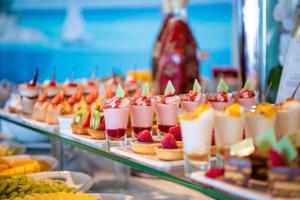a buffet line of desserts and drinks on display at Hotel Cascais Miragem Health & Spa in Cascais