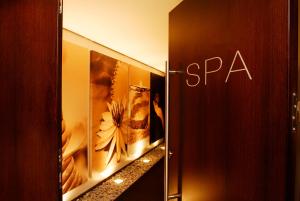 a hallway with pictures of flowers on the wall at Hotel Cascais Miragem Health & Spa in Cascais
