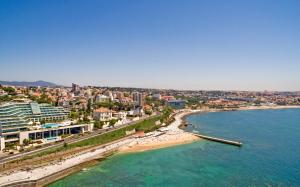 an aerial view of a beach and the ocean at Hotel Cascais Miragem Health & Spa in Cascais