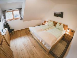 A bed or beds in a room at Appartements Macheiner