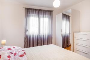 Postel nebo postele na pokoji v ubytování SOLU Apartment