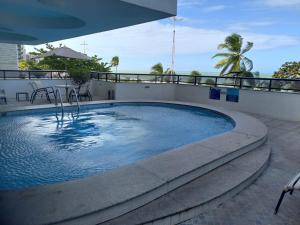 a swimming pool on the roof of a building at Hotel Euro Suíte Recife Boa Viagem By Nacional Inn in Recife