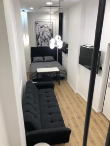 Televízia a/alebo spoločenská miestnosť v ubytovaní Main Square Luxury Apartment