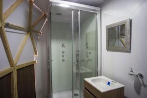 a bathroom with a shower and a sink at Glamping Reserva del Dorado in Sesquilé +73 photos