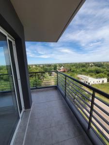 a balcony with a view of the countryside at Departamento con vista al río in Victoria