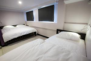 The Blocks Hostel Sukhumvit 10客房内的一张或多张床位