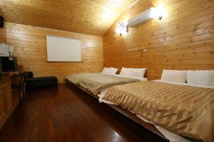 Rúm í herbergi á Ji Ji Farm Homestay