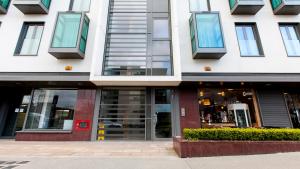 a building with windows and doors on a street at The Forum in Dublin