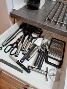 a drawer filled with lots of kitchen utensils at Lifestyle-Appartment near BASF in Ludwigshafen in Ludwigshafen am Rhein