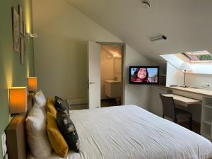 Postel nebo postele na pokoji v ubytování Hotel & Apartments Bibois Leuven