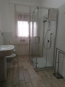 a bathroom with a shower and a toilet and a sink at B&B AL PASSIO in Palermo
