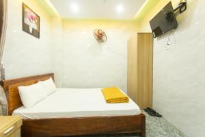 Giường trong phòng chung tại Thuận An Hotel
