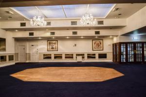 a large room with a large rug in the middle at Himley Country Hotel in Dudley
