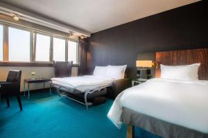 Llit o llits en una habitació de Radisson Blu Hotel, Hamburg