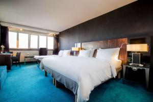 Llit o llits en una habitació de Radisson Blu Hotel, Hamburg