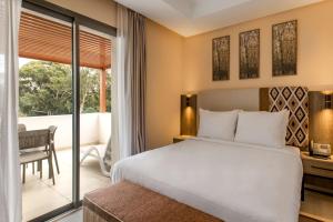 Postel nebo postele na pokoji v ubytování Radisson Blu Residences Al Hoceima
