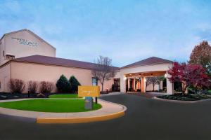 a rendering of a school building with a sign in front at Sonesta Select Newark Christiana Mall in Newark