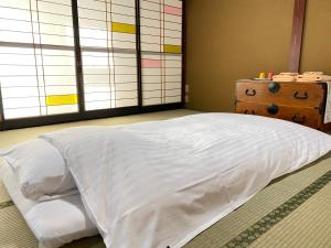 ゲストハウス山吹客房内的一张或多张床位