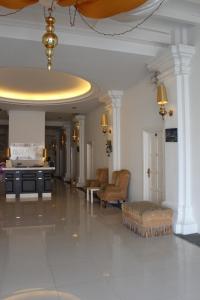 a large lobby with a gold ceiling and a living room at Chulia Heritage Hotel in George Town