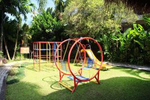 a childrens playground with a colorful roller coaster at Daily Home Apartment in Bandung