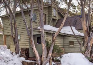 a house with snow on the roof at Tambo in Dinner Plain