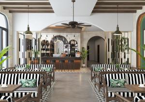 a restaurant with black and white chairs and a bar at Khách sạn Nga Sơn in Nga Sơn