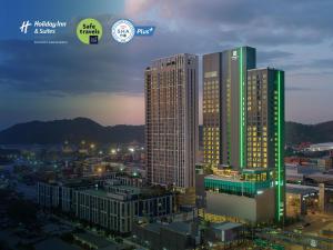 a rendering of a tall building in a city at Holiday Inn & Suites Siracha Laemchabang, an IHG Hotel in Si Racha