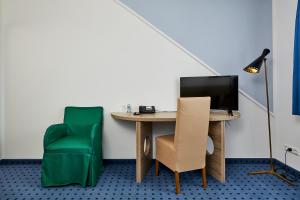 TV a/nebo společenská místnost v ubytování Hotel Schwertfirm