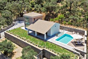 an aerial view of a house with a swimming pool at Villa Barocco Corfu in Kamára