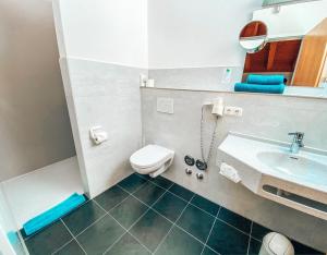 Koupelna v ubytování Hotel Schwertfirm