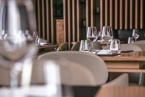 a group of wine glasses sitting on a table at Mosella Suite Hotel in Sottomarina