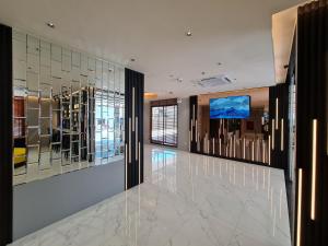 a lobby with mirrored walls and a dance floor at The Neuf@Ratchada in Bangkok +24 photos