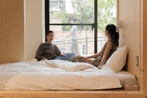 Voodi või voodid majutusasutuse 山鄰山林青年文旅 forest 3030 hostel toas