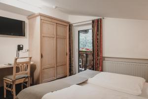 Łóżko lub łóżka w pokoju w obiekcie Hotel & Appartements Tiroler Buam