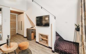 Telewizja i/lub zestaw kina domowego w obiekcie Hotel & Appartements Tiroler Buam